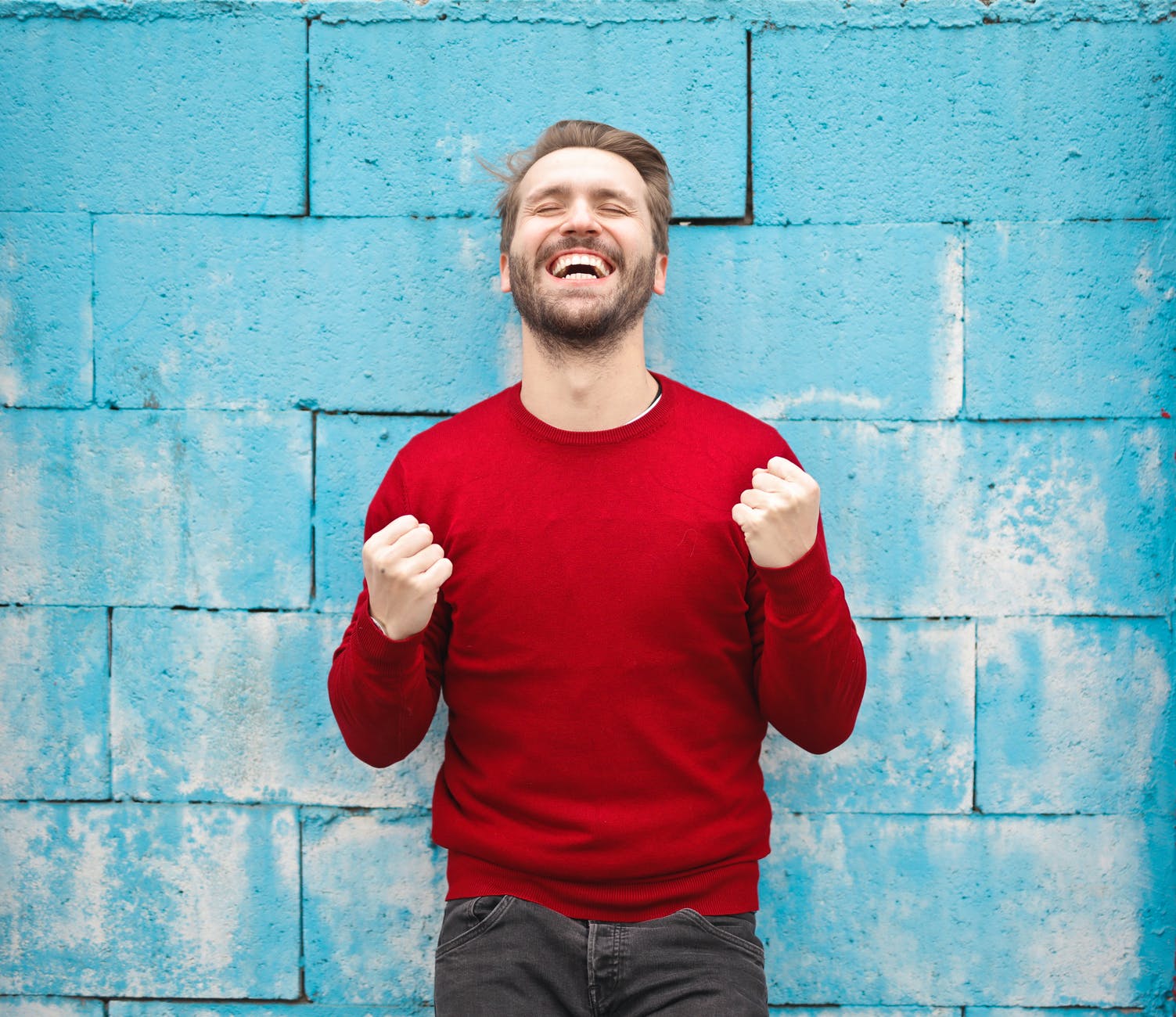 man in red crew neck sweatshirt photography